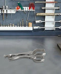 Heavy Duty 9 Inch U Shaped Welding Pliers Steel Clamp With Strong Bite Force Perfect For Mig Tig Welding Riveting And Grinding Adjustable Handle Silver Tool That Grips Hard on a workbench.