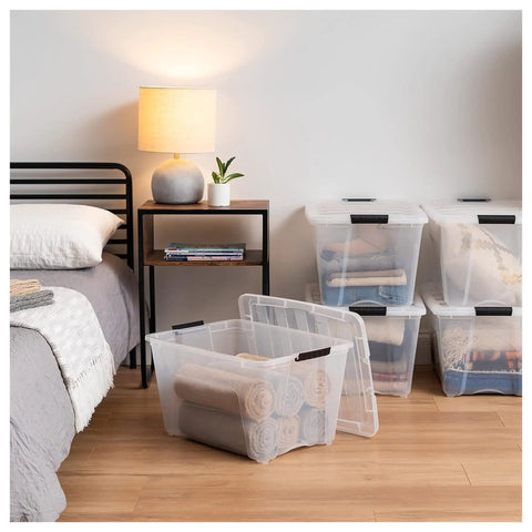 Straight Up Premium 54 Qt Stackable Storage Bins With Lids 12 Pack Clear Plastic Totes For Closets And Garages BPA Free Made In USA on hardwood floor.