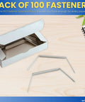 Open box of Metal Prong File Fasteners, 2 Inch Prongs, 2.75 Inch Center-To-Center, Pack Of 100, Silver Finish on desk