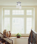 Three Light Semi Flush Mount Ceiling Light With Brushed Steel Finish and Clear Glass Shades in a bright hallway