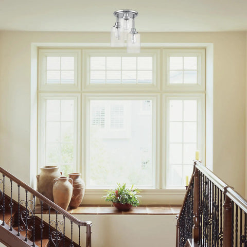 Three Light Semi Flush Mount Ceiling Light With Brushed Steel Finish and Clear Glass Shades in a bright hallway