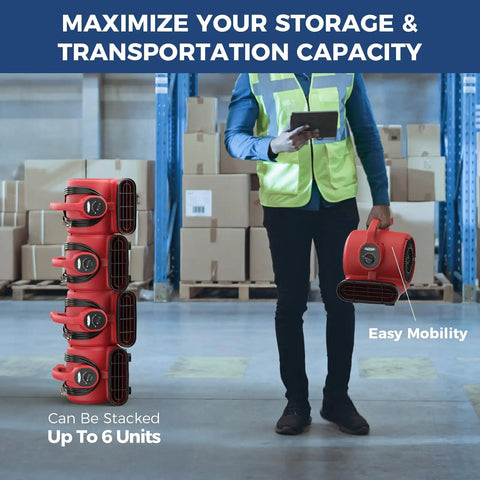 Worker carrying 600 CFM Air Mover Blower Fan, showcasing stackable design for efficient storage in industrial setting. Ideal for water damage restoration.