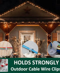100 Pack Half Inch P Style Rope Light Clips With Stainless Steel Screws for attaching lights to a home's exterior at night.