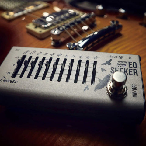 Close-up of 10 Band Graphic EQ Pedal For Guitar And Bass True Bypass Design Compact EQ Seeker with visible sliders and on/off switch.