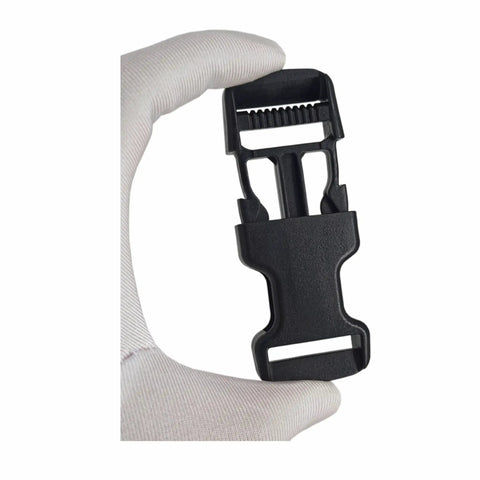 Gloved hand holding Replacement Quick Release Buckles For 1 Inch Straps 6 Pack With 12 Tri Glide Fasteners Heavy Duty Black Easy Repairs