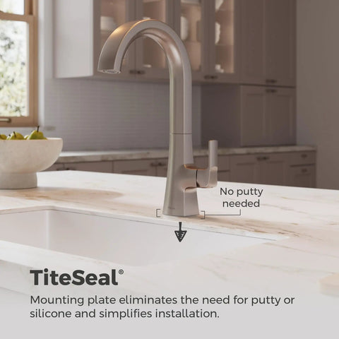 Pfister Vaneri Kitchen Faucet with Pull Down Sprayer, Stainless Steel mounted on a kitchen sink with a modern design.