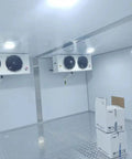Interior view of Custom Cold Room Build Top Shelf Heavy Duty Industrial Walk In Freezer with dual fans and storage boxes.