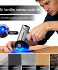 Cordless cutting tool with LED display, silver body and blue LED light for cardboard and fabrics.