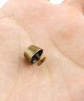 Badass 25 Piece Bronze Bucket Foot Studs With Screw Back Spike Rivets, Legit 1/2 Inch Zinc Alloy Hardware For Handbags And Leather Crafting Projects in hand.