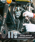 Mechanic installing Predator 212 Exhaust Muffler Gasket Kit for 212cc Non Hemi Carb Exhaust Pipe on a go-kart engine