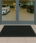Outdoor Scraper Floor Mat 3 By 5 Ft Natural Rubber Durable Shoe Scraper With Beveled Edges placed at entryway