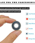 R6-2RS bearing, miniature deep groove ball bearing, 3/8 in ID x 7/8 in OD, double rubber sealed, held between fingers