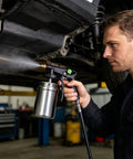 Top Tier Truck Undercoating Spray Guns Offer Heavy Duty Auto Body Sprayer Gear For Metal Rims And Frame With Smart Adjust Flow Nozzles spraying under a vehicle.