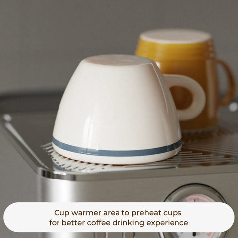 Compact Espresso Machine With 20 Bar Pressure And Digital Temp Display Built In Milk Frother for warming cups on top.