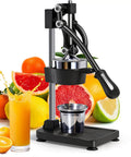 Heavy Duty Manual Cast Iron Citrus Juicer Hand Press Squeezer For Fresh Orange Lemon Juice with juice splashing on a black countertop.
