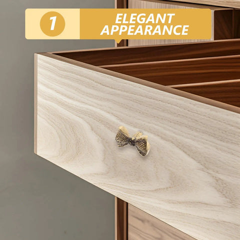 Copper Bowknot Cabinet Handle And Drawer Pull Kit In Vintage Brass Finish on wooden drawer