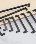 Matte Black Cabinet Handles Square Drawer Pulls 3 Inch Hole Centers Stainless Steel 10 Pack displayed on wood and marble surface