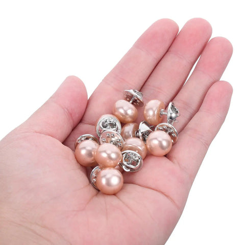 25Pcs No Sew Faux Pearl Brooch Pins Detachable Sweater Clips Reusable Shirt Fasteners held in a hand, showcasing the shiny pearl design.