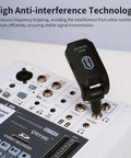 Wireless In Ear Monitor System 2.4GHz With Transmitter And Clip On Receiver on audio mixer showing anti-interference tech