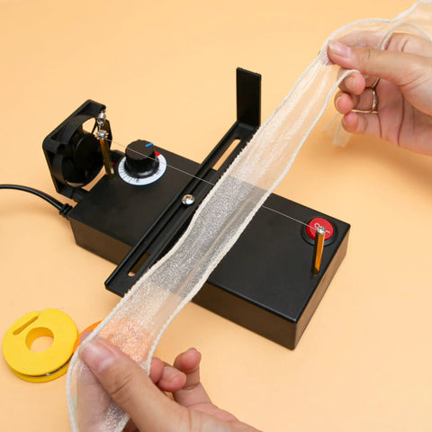 Electric Ribbon Cutter And Sealer with Adjustable Heat Range showing lace cutting in action, includes heating reels and US plug.