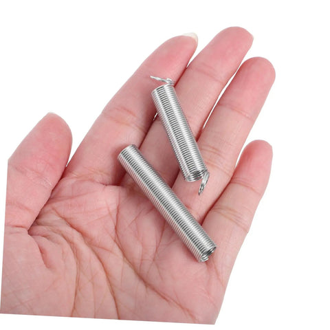 Stainless Steel Spring Assortment Kit 200 Pcs For Home Repairs And DIY Projects Featuring Versatile Compression Extension Springs With Stable Force For Machinery And Various Applications, two springs in hand