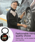 Mechanic working on car tire with 'I Fix Stuff and I Know Things' keychain shown for Keychain Gift For Men I Fix Stuff And I Know Things Ideal Dad Gift For Mechanic Handyman Construction Worker Engineer Husband Grandfather Birthday Or Fathers Day Gift For Any Proud Dad Who Fixes Stuff And Keeps Projects Rolling.
