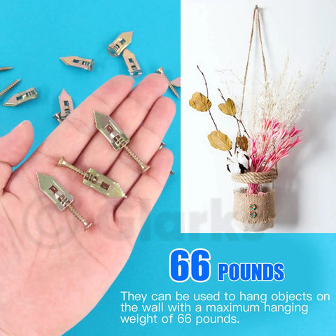 Hand holding 100 Count Drywall Self Drilling Anchors And Screws Kit For Quick Mounts In Gypsum Board with vase on wall.