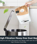 Lightweight Canister Vacuum Cleaner With Hella Powerful 1200 Watt Suction For Carpets Hard Floors And Stairs Comes With Five Dust Bags For Zero Sweat Whole House Cleanup Moves Smooth Yellow dust bag being disposed in a metallic trash can.
