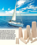 Boater Ready Wooden Conical Bungs Plugs Set Ten Pcs For Thru Hull Emergency Seals in assorted sizes next to a sailing yacht on water.