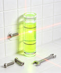 6Pcs Small Cylindrical Bubble Level Vials 10X35Mm Pmma Mini with screws and wrench on tiled wall, featuring bright green liquid.