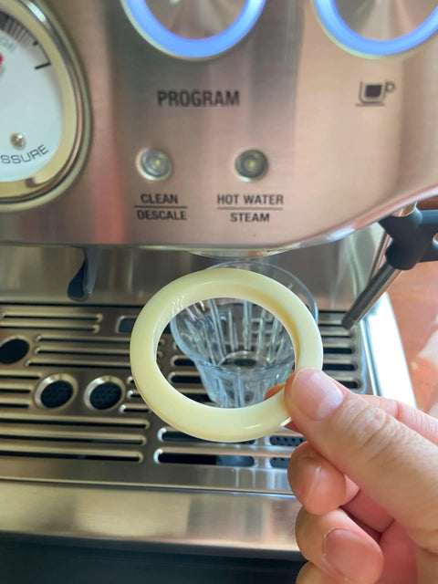 Hand holding 54 Millimeter Silicone Gasket Sealing Ring Compatible With Breville And Sage Espresso Machines 870 878 880