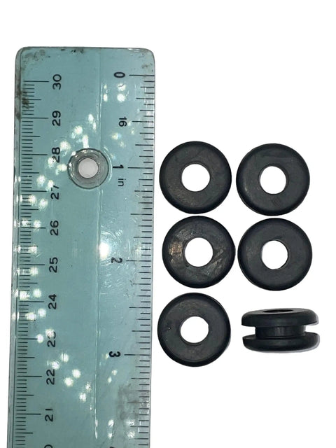 Pack Of Four Rock Solid Rubber Grommets With Five Sixteenths Inch Bore And Three Quarter Outer Profile, displayed next to a ruler.