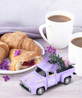Mini Lavender Metal Truck With Lavender Bouquet Farmhouse Decor Vintage Purple Pickup Tiered Tray Accent For Country Home Rustic Metal Truck Decoration For Shelves And Tables Adorable Small Space Decor next to coffee and croissants.