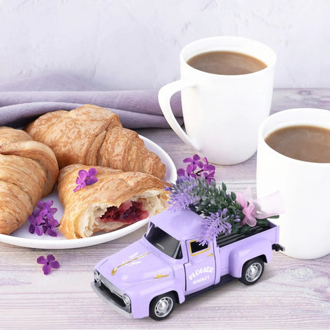 Mini Lavender Metal Truck With Lavender Bouquet Farmhouse Decor Vintage Purple Pickup Tiered Tray Accent For Country Home Rustic Metal Truck Decoration For Shelves And Tables Adorable Small Space Decor next to coffee and croissants.