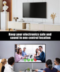 Living room with a TV and modern furniture, showcasing the Hassle Free 3 Foot Flat Plug Extension Cord Power Strip With Three Upward Outlets Low Profile Design.