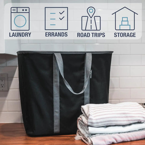 Collapsible Laundry Caddy 2 Pack 64L Cream Charcoal Foldable Laundry Basket beside folded clothes on counter top