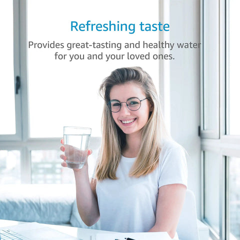 Woman enjoying water purified with Replacement Under Sink Water Filter For Culligan 1000R in a modern kitchen setting.