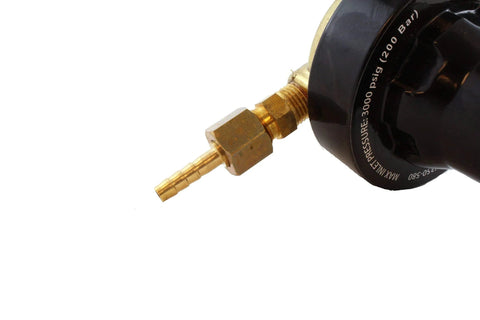 Inert gas regulator close-up showing brass barbed inlet fitting on a black regulator body