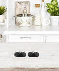 4pcs Small Furniture Adhesive Swivel Caster Wheels displayed on a kitchen counter, featuring a black design and easy installation.