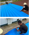 Two workers applying Heavy Duty Self Adhesive Asphalt Roofing Tape With Thick Aluminum Foil on a blue flat roof.