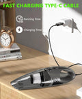 Cordless Handheld Vacuum Cleaner With 11KPa Strong Suction And Up To 25 Minutes Runtime charging on a wooden table with Type-C cable