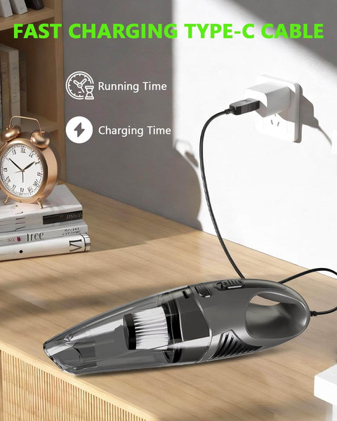 Cordless Handheld Vacuum Cleaner With 11KPa Strong Suction And Up To 25 Minutes Runtime charging on a wooden table with Type-C cable