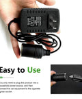 Top Shelf 120V To 12V 24W Ac Dc Converter Adapter Swaps Wall Outlet Power For Your Favorite Ride Ready Car Tools Like Tire Inflators Or Mini Coolers Without Breaking A Sweat, hand-held view of adapter with cord and cigarette lighter socket.