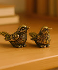 Brass Sparrow Hinge Heads Set Of Four Vintage Bird Figurines on shelf; solid brass, lifelike details, for home decor.