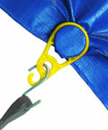Close-up of 15 Pack Tarp Clips for Outdoor Camping and Shelter Setup attached to blue tarp with metal hook