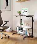 Hella Sturdy Adjustable Standing Desk On Smooth Lockable Wheels, Super Slick Rolling Laptop Station With Storage Shelves, Easy Setup Grey Oak Home Office Daily Driver in use with chair and laptop.