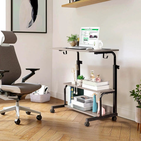 Hella Sturdy Adjustable Standing Desk On Smooth Lockable Wheels, Super Slick Rolling Laptop Station With Storage Shelves, Easy Setup Grey Oak Home Office Daily Driver in use with chair and laptop.