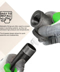 Gloved hands holding 6 Inch 90 Degree Malleable Iron Elbow Fitting With Female Threads Black Finish For High Pressure Systems 150 Lb Rated Rugged Industrial Pipe Connector For Severe Service