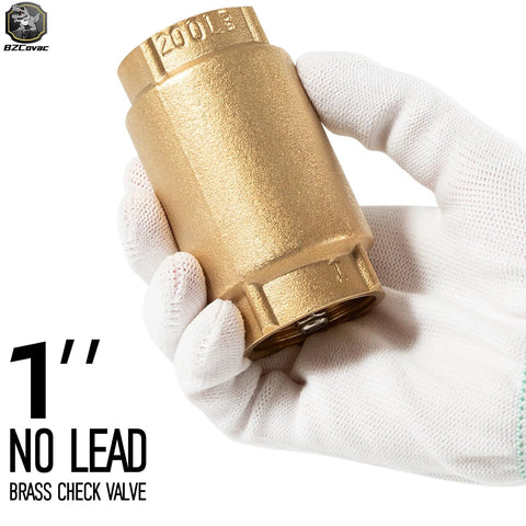Close-up of 1-inch no-lead brass check valve with FNPT fittings held by gloved hand