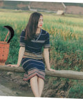 Long Handle Hand Scythe For Weed Removal And Grass Control Manganese Steel Weeding Tool in rustic setting with woman.